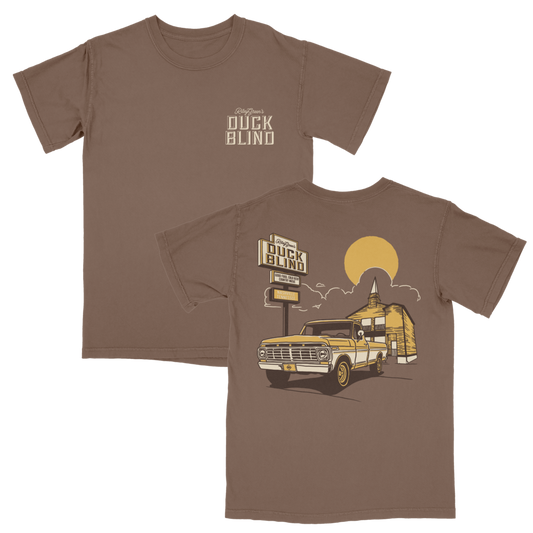 Brown t-shirt with a graphic of a truck and 'Duck Blind' text on a white background and Riley Green diamond logo on license plate