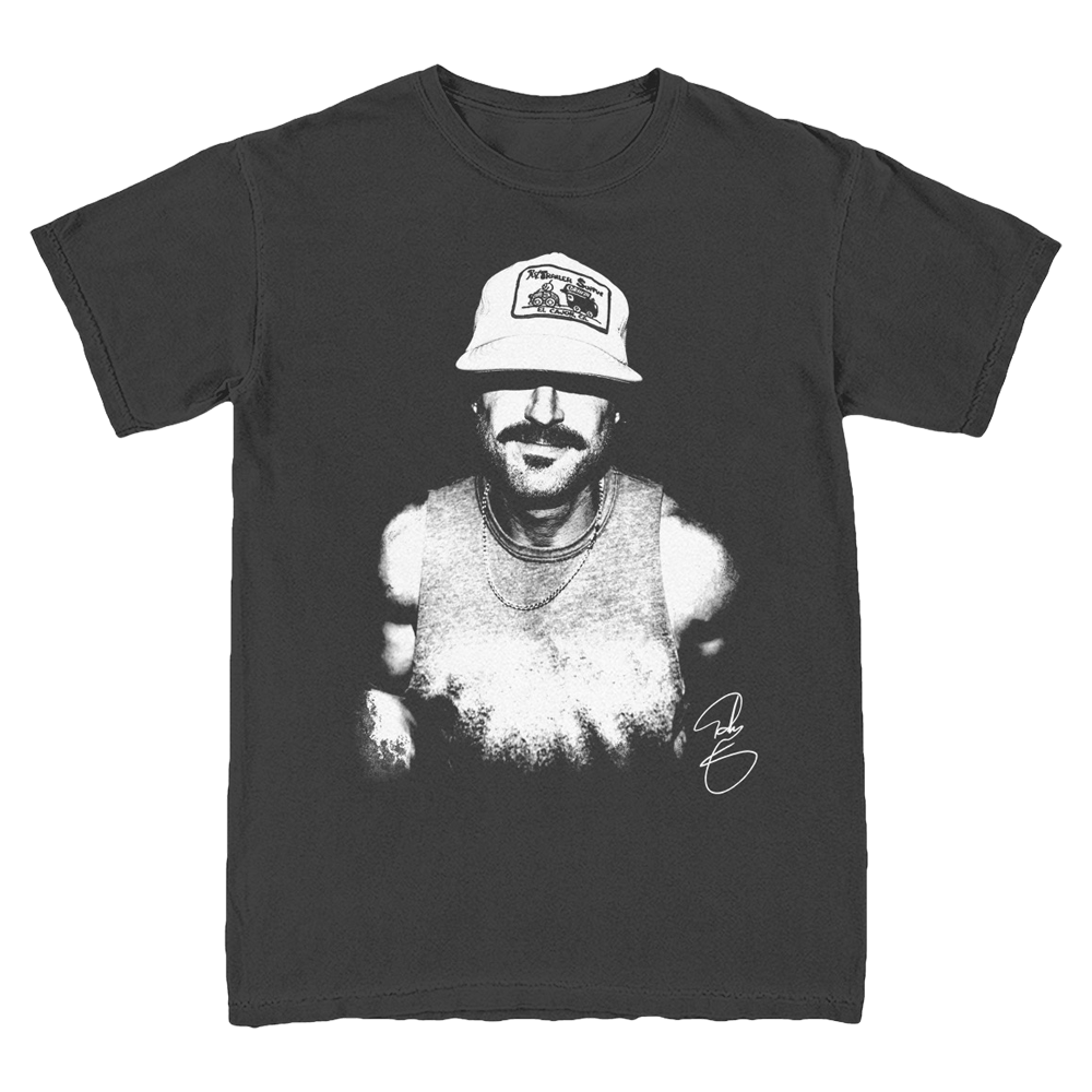 A black crew neck t-shirt with a white graphic print of a person wearing a hat on the front.