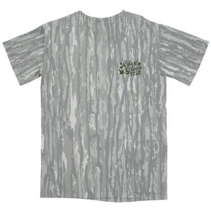 Gray camouflage t-shirt with a logo on the back against a green background
