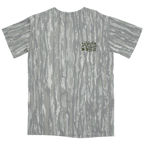 Gray camouflage t-shirt with a logo on the back against a green background