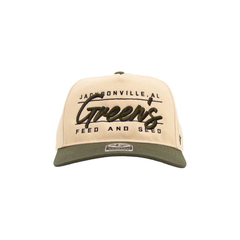 Beige and green cap with text on a white background. Green's Feed and Seed '47 hat. Riley Green